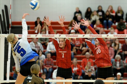 Willmar eighth-grader Ellery DeBoer, 7, and freshman Brielle Ogdahl, 10, go for a block on Sartell's Ellie Rengel during a Central Lakes Conference match on Tuesday, Sept. 27, 2022 at the Big Red Gym at Willmar High School.