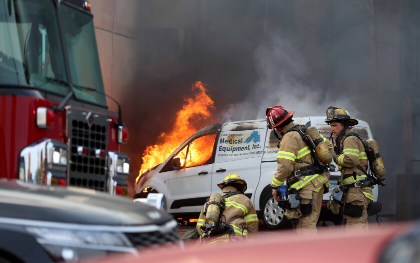 A van appears to be on fire