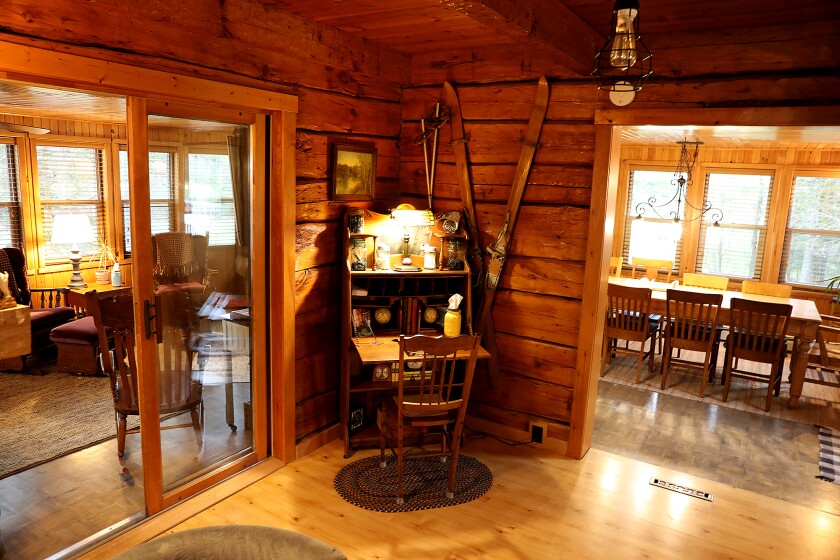 A writing desk is tucked in a corner