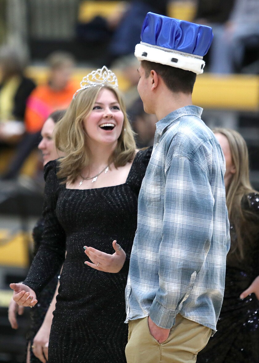 Queen Kylie Olson, left, looks in amazement at king Gus Degitz after being crowned Northwestern’s Snow Week royalty