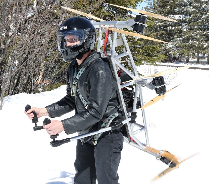 Daniel Gant, founder of Ascend Dynamics, LLC, dons the prototype of his SkyPak, a propeller-driven jetpack