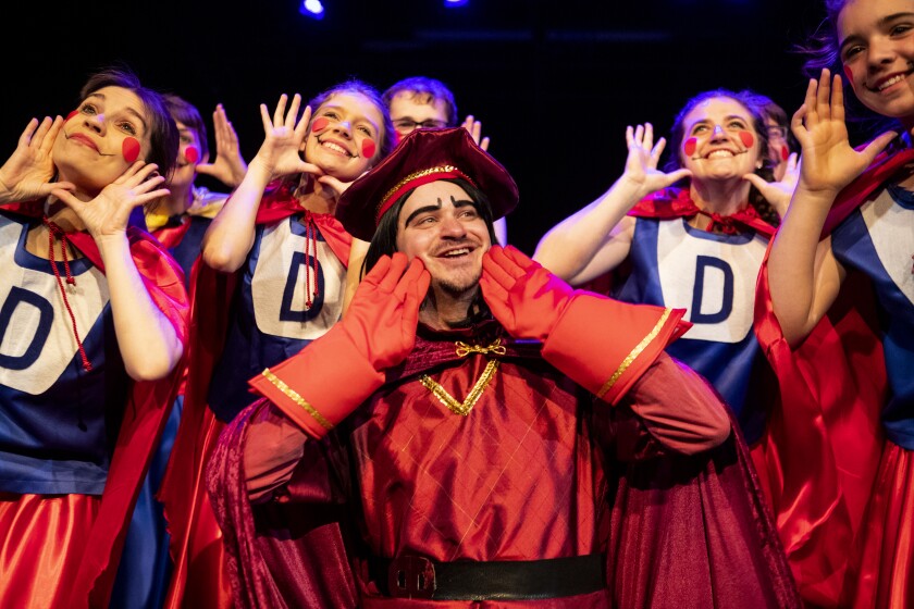 Lord Farquaad, played by Matt Onnen, sings and dances while being surrounded by members of Duloc during a dress rehearsal for Shrek the Musical at the Barn Theatre on Saturday, June 4, 2022.