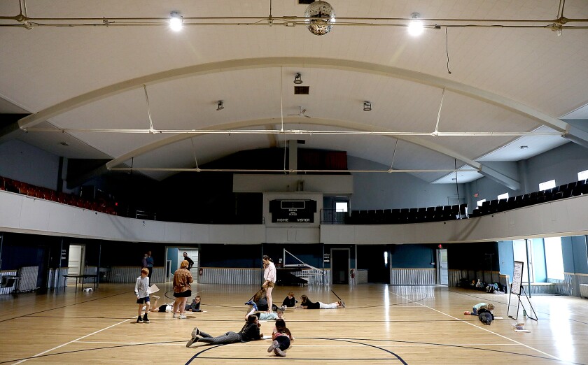 Campers work on basketball court.