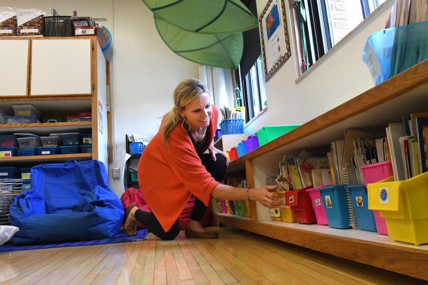 Arranging the books Monday, Aug. 27, in the reading nook in her classroom, Lowell Elementary School first-grade teacher Christa Miller prepares for the first day of school Sept. 4. Steve Kohls / Brainerd Dispatch