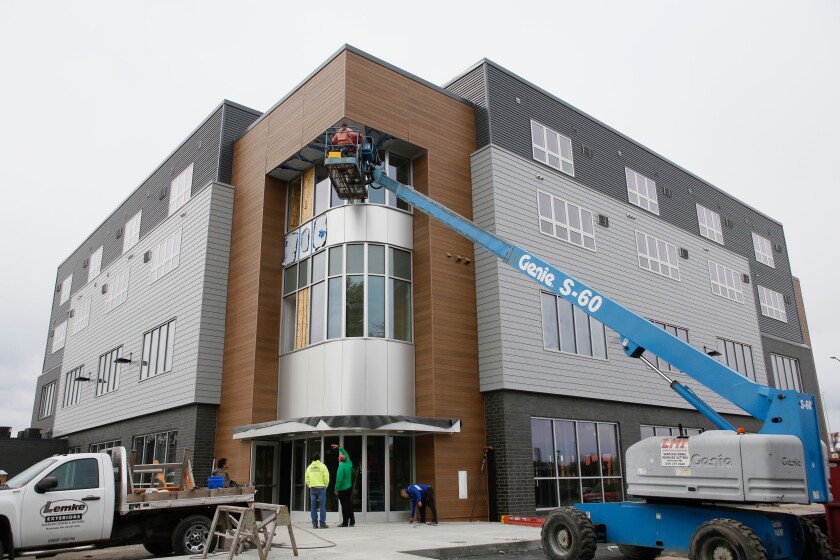 'This project has become the signature of downtown Moorhead.' Block E ...