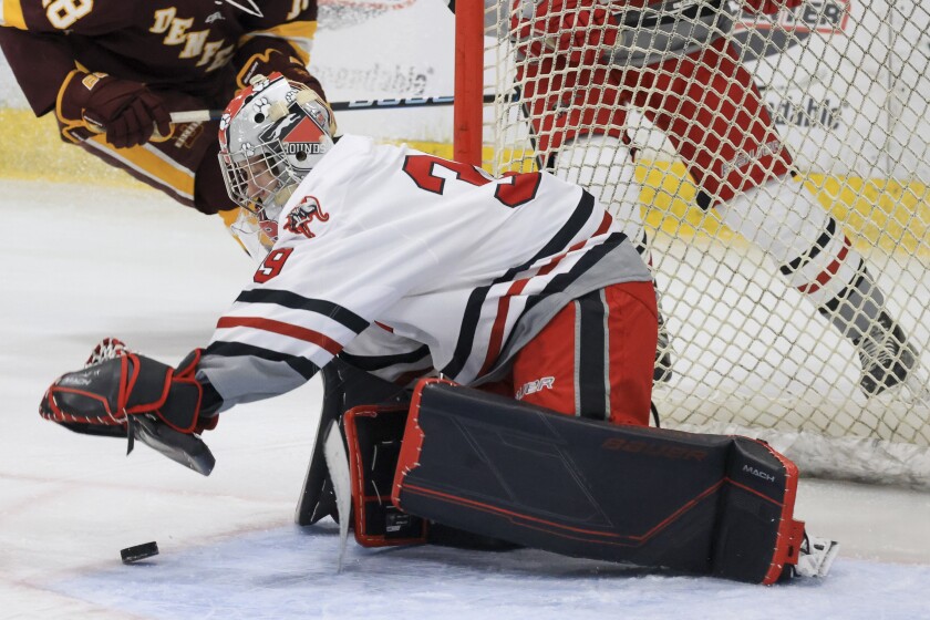 high school boys play ice hockey