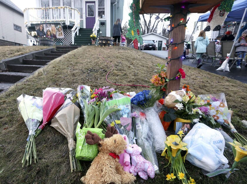 Vigil held for slain family.