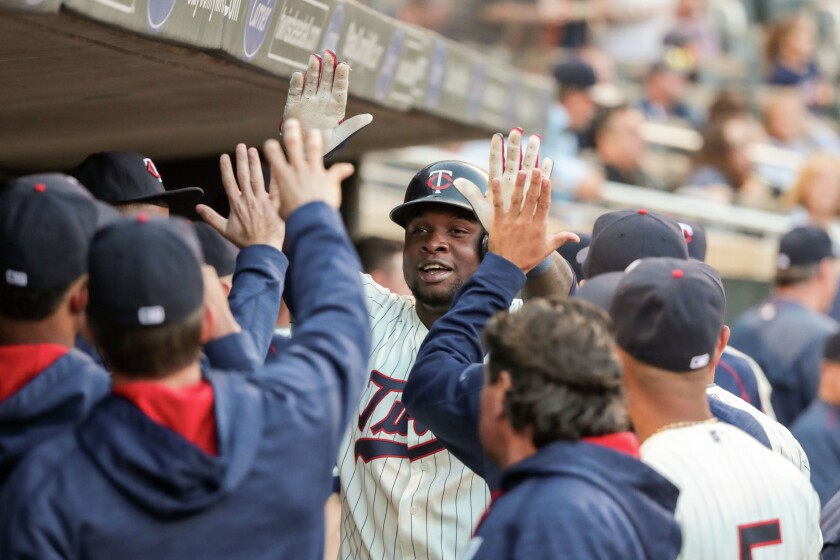 Minnesota Twins designated hitter Miguel Sano (22) celebrates with teammates after hitting a home run during the second inning Saturday against the Cleveland Indians at Target Field. Mandatory Credit: Jordan Johnson-USA TODAY Sports