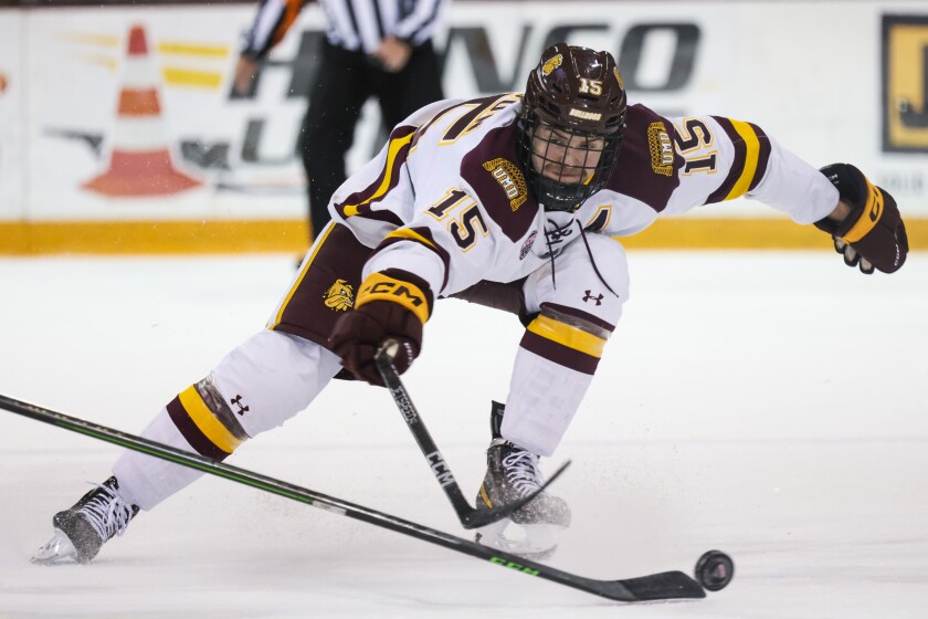 college men play hockey