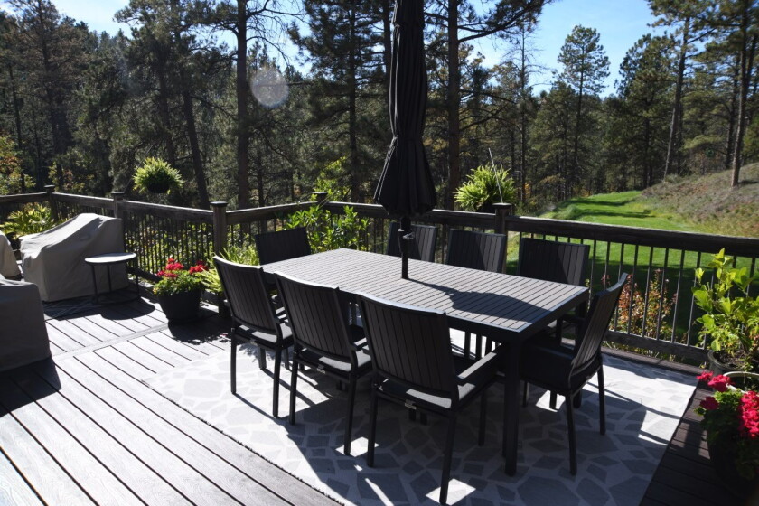 A patio setup shows off a nice view of the Black Hills forest.