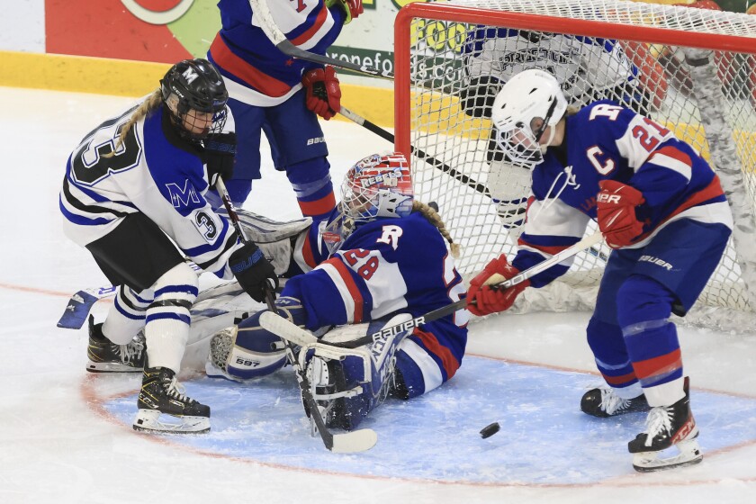 high school girls play hockey