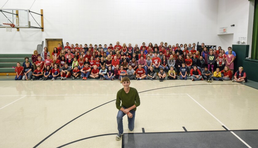 More than 150 students, teachers and staff wore red to show their support for Bennett Namanny, center, who will undergo heart surgery on Wednesday in Omaha, Nebraska. (Matt Gade / Republic)