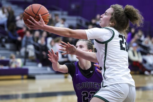 high school girls play basketball