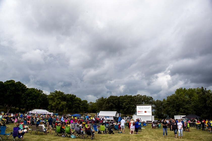 Rains from a passing storm caused nearly an hour-long weather delay between musical acts during Rockin' Robbins at Robbins Island Regional Park in Willmar on Tuesday, July 26, 2022.