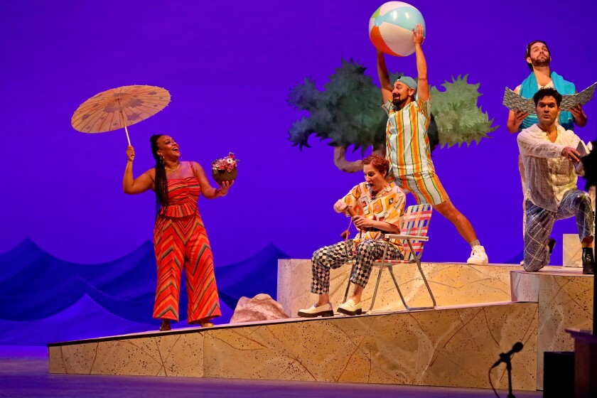 Actors perform on stage.