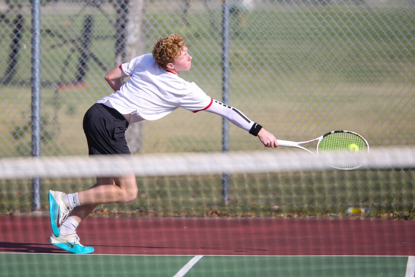 Grand Forks Red River tennis player Max Mecham stretches to return a shot in a match against his teammate Kevin Martinez during the East Region Boys Individual Tournament on Friday, Oct. 3, 2025, at Horizon Middle School in south Fargo.