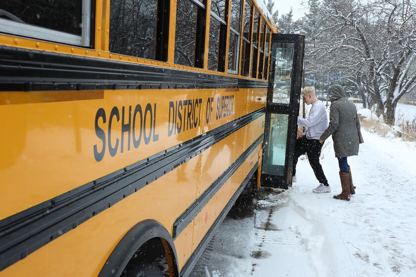 Superior High School student Cole Stallsmith, left, and teacher Christa Kalin enter the bus after the SHS group toured Glensheen Mansion