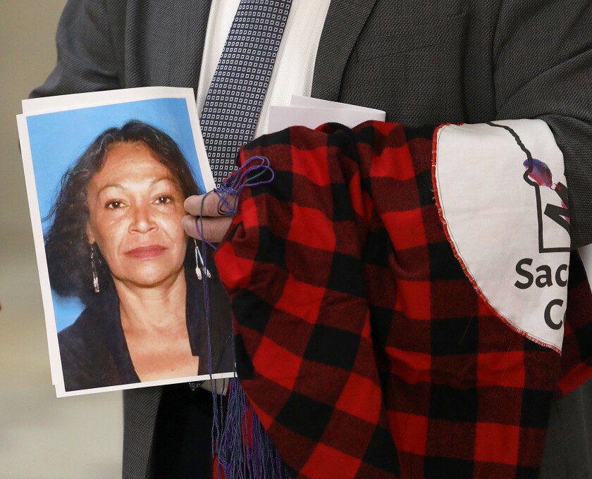 Duluth Police Chief Mike Tusken holds a photograph of Sheila St. Clair