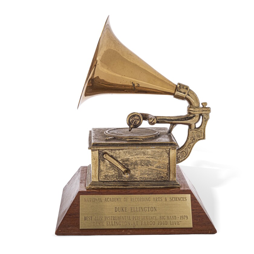 A brass gramophone tops a Grammy award. An attached plaque reads "National Academy of Recording Arts & Sciences, Duke Ellington, Best Jazz Instrumental Performance - Big Band - 1979, Duke Ellington at Fargo 1940 Live."