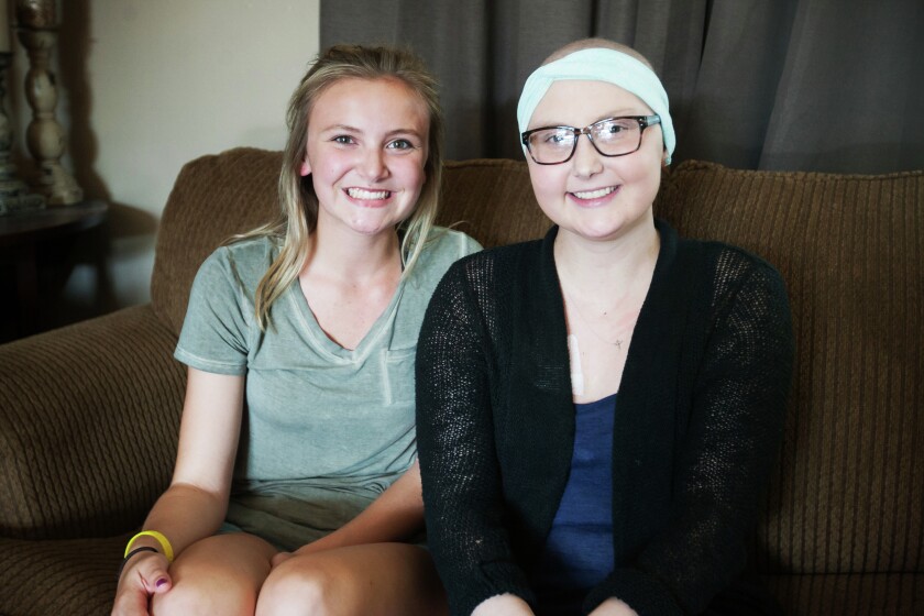 Rylie Heisler (right) and her sister Hadyn pose for a portrait at their home in East Grand Forks, Minn. on June 7, 2016. (Meg Oliphant/Grand Forks Herald)