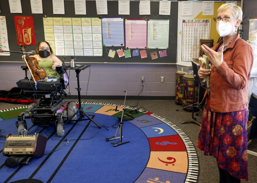 Gaelynn Lea performs a song for students at Cloquet’s Churchill Elementary School.