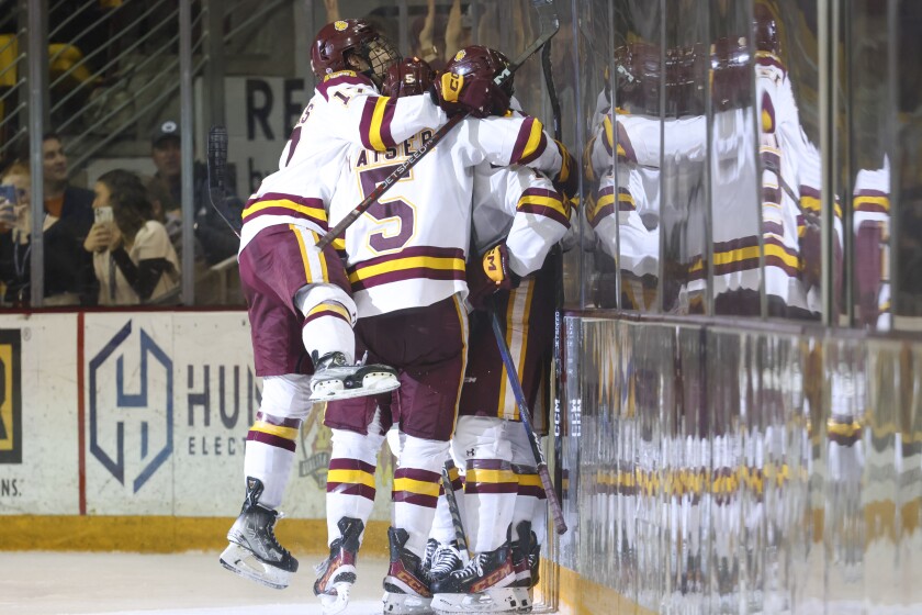 college men play hockey
