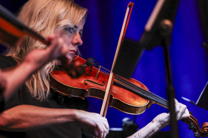 musicians perform on stage
