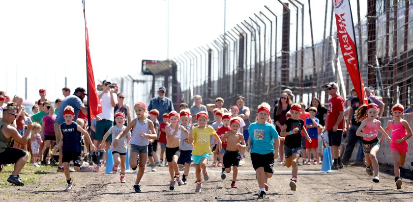 Kids ages 5 through 7 start running in the initial heat of the first-ever TriForHealth obstacle run during the Jackson County Fair Saturday at the Jackson Motorplex.