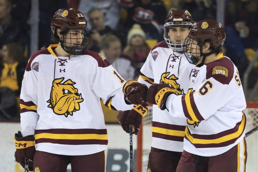 college men play ice hockey