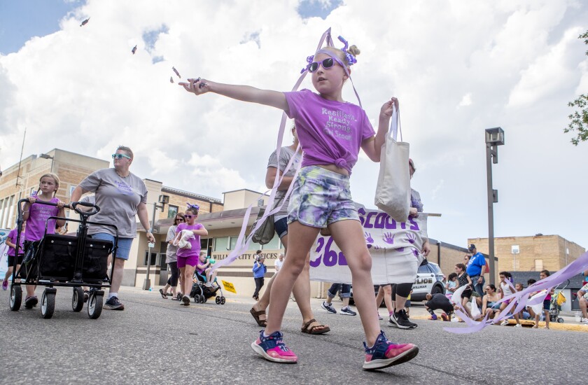 Children toss candy to spectators during the Kiddie Parade along 6th Street in downtown Willmar during Willmar Fest on Thursday, June 23, 2022.