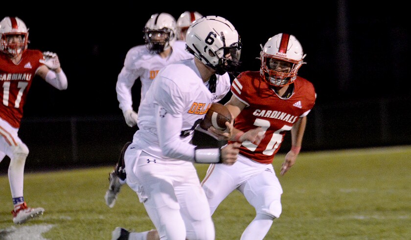 Willmar sophomore Steven Cruze, 26, gives chase to Delano's Cade Bruett during a North Central White District game on Friday, Sept. 30, 2022 at Hodapp Field.