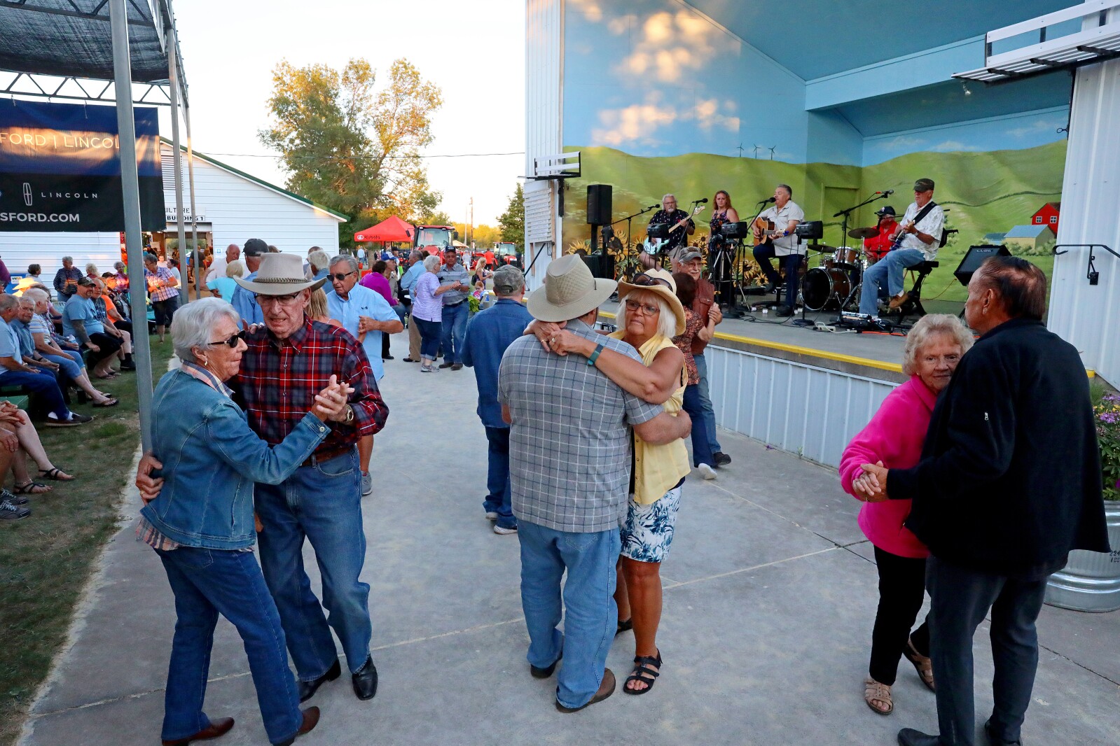 Couples dance to the music of the Alan Godage Band at the Crow Wing County Fair.