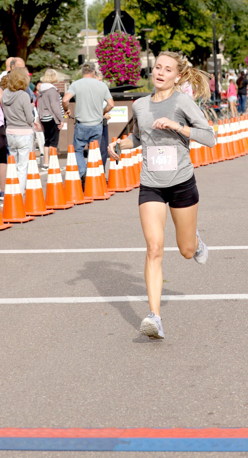 Kaitlin Goforth approaches the finish line to win in the women's category of the Annual Worthington Area YMCA 10K race Saturday morning held during King Turkey Day Celebration.