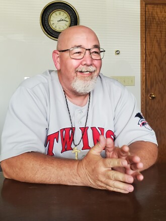 Leonard Skillings sits at table