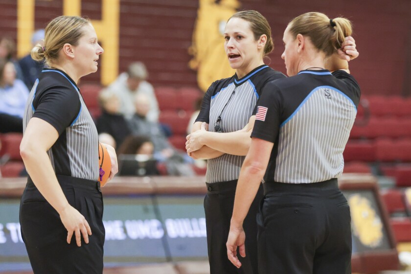 College women play basketball