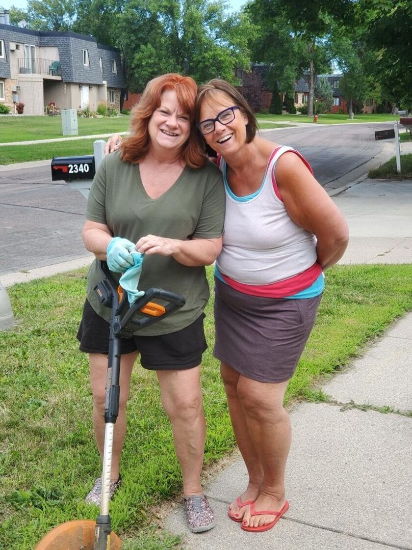 Noreen_Penny Beckstrom, left and Noreen work to get Noreen's former home in shape for sale.jpg
