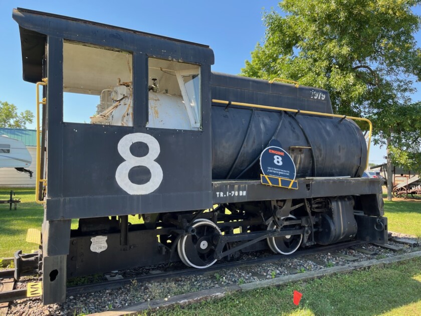 A view from the side of the locomotive engine that sits on the Crow Wing County Fairground.