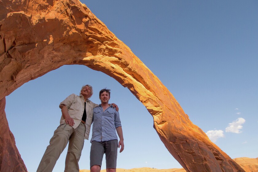 Local father and son photographic team Gary and Sayer Payne pause beneath a gigantic arch that remains after 60 million years of erosion at Utah's Dead Horse Point State Park. Gary Payne will speak at noon and again at 7 p.m. Feb. 5 in Central Lakes College’s Cultural Thursday program.