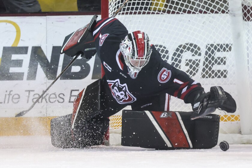 College women play ice hockey