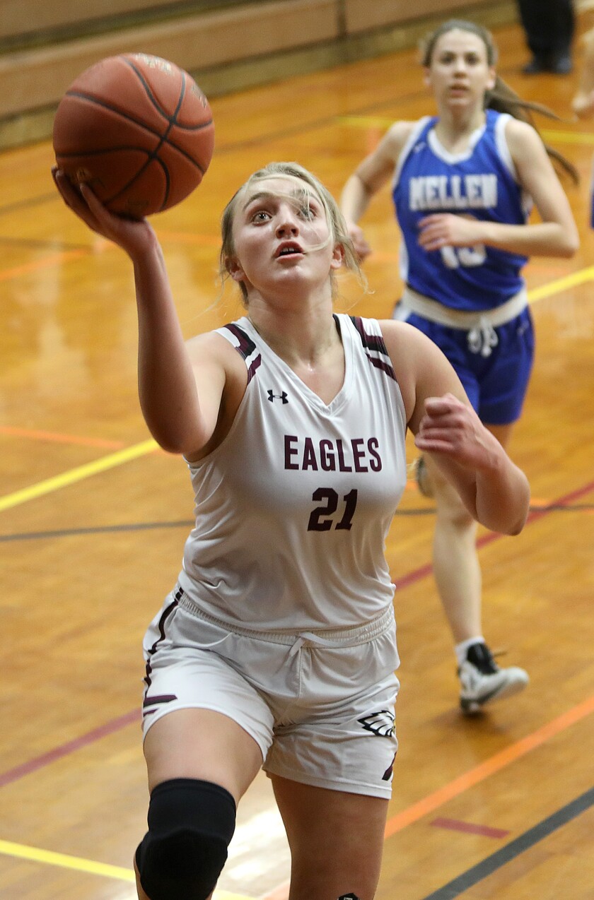 Solon Springs’ Claire Holmstrom (21) goes in for a lay-up