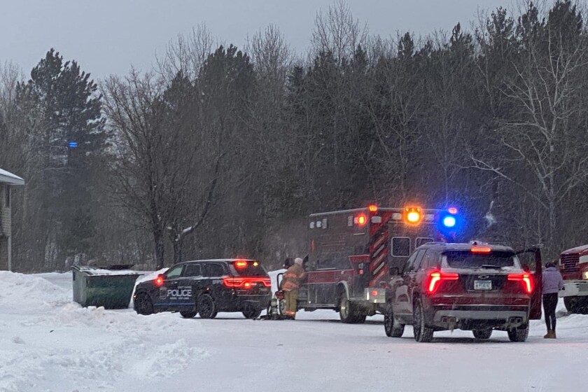 ambulance and police cars at fire scene