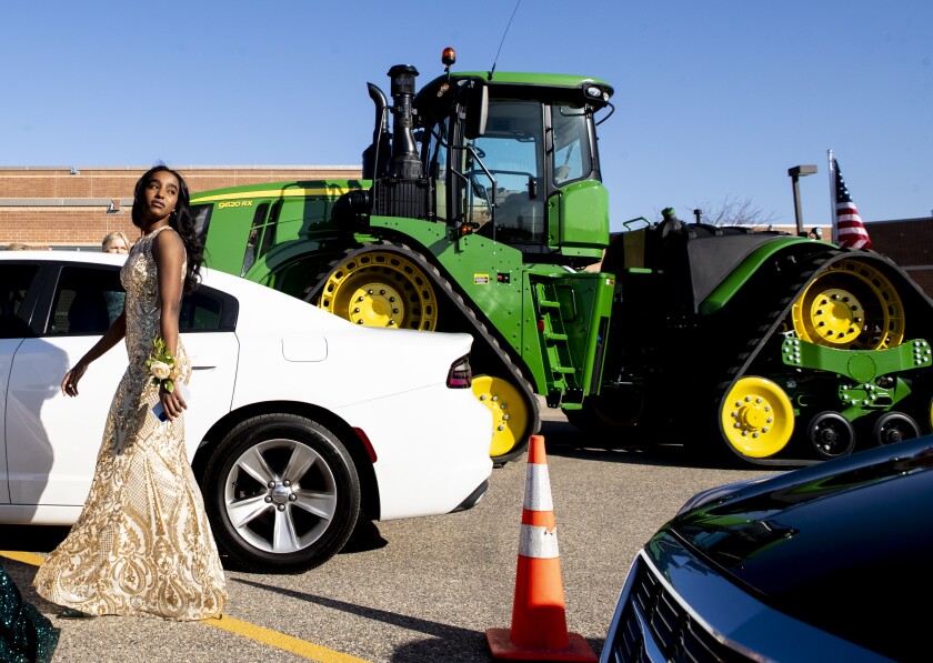Prom attendees mingle in the parking lot while waiting for festivities to begin on Friday, May 6, 2022, at Willmar High School.