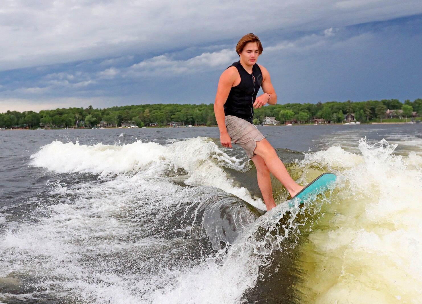 Parker Linn demonstrates wake surfing for people during the ninth annual Bar Harbor In-Water Boat Show on Saturday, June 18, 2022, on Gull Lake. Watercraft for the boat show were brought by Nisswa Marine and Minnesota Inboard Water Sports and a Wake Responsibly event taught attendees boat safety and responsibility.