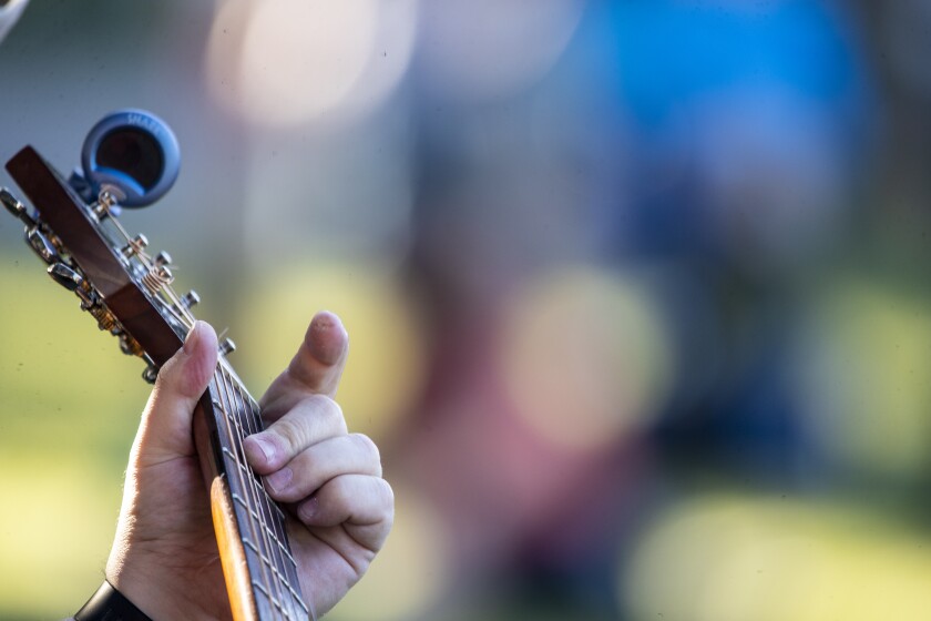 Jay Ellingson of the band, Acoustic Vibe, plays his guitar during a set at Rice Park during Willmar Fest on Wednesday, June 22, 2022.