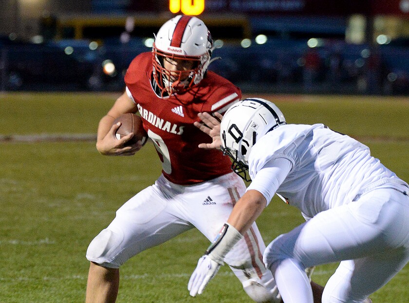 Willmar junior Cullen Gregory, left, goes for a stiff arm on a Delano defender during a North Central White District game on Friday, Sept. 30, 2022 at Hodapp Field.