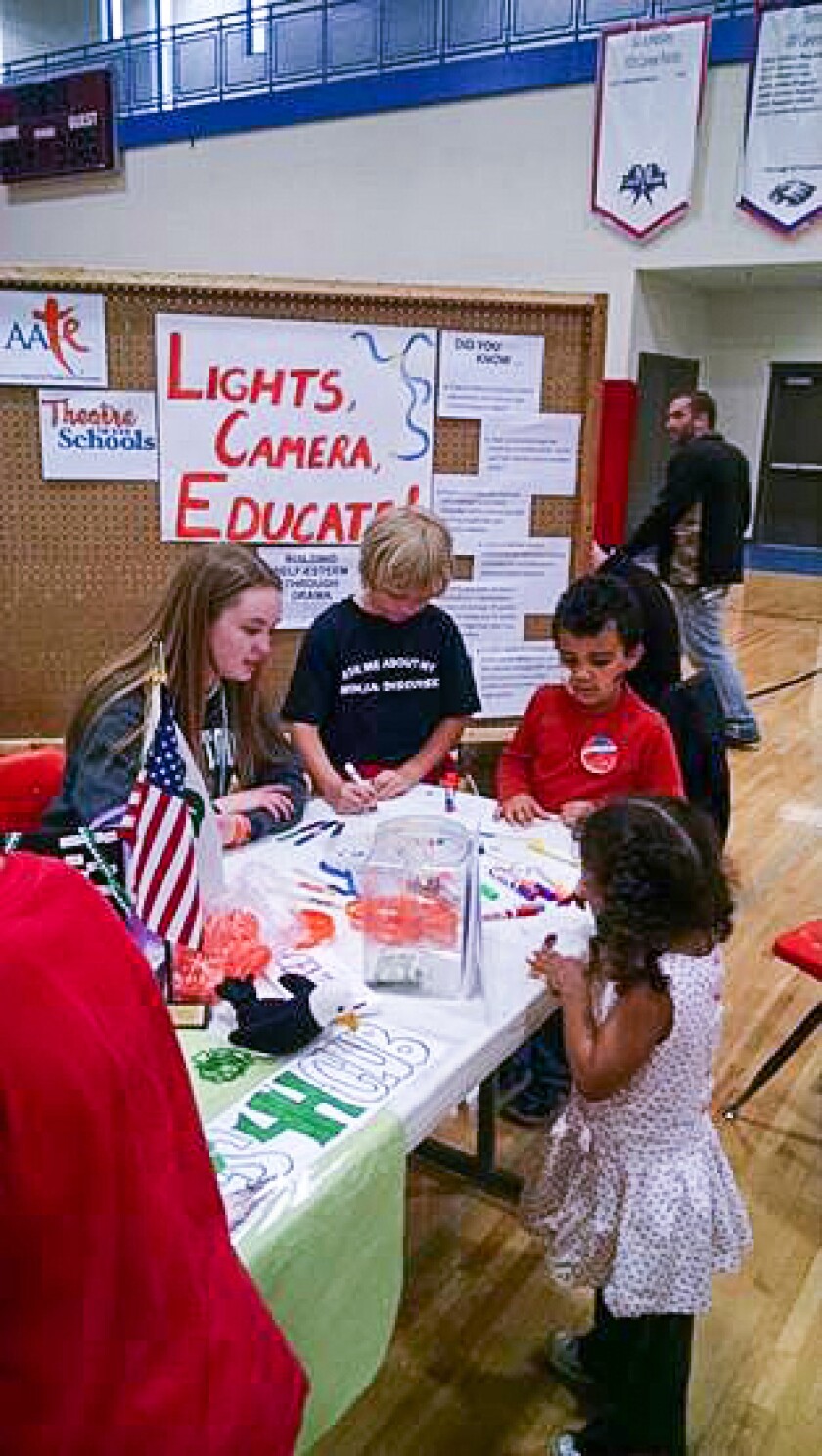 Rylie Young, Miss Central Minnesota’s Outstanding Teen, helps other students at the Festival of the Arts in Pequot Lakes with her platform - Lights, Camera, Educate! Submitted Photo