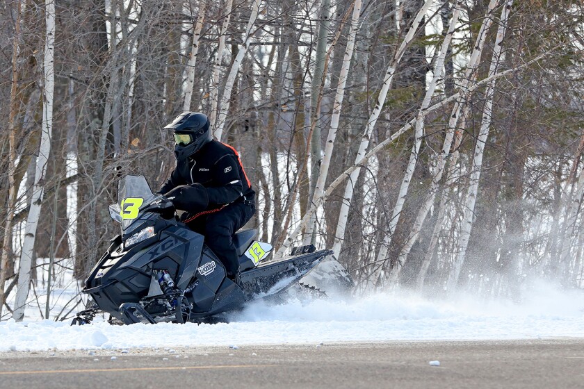 Snowmobilers race