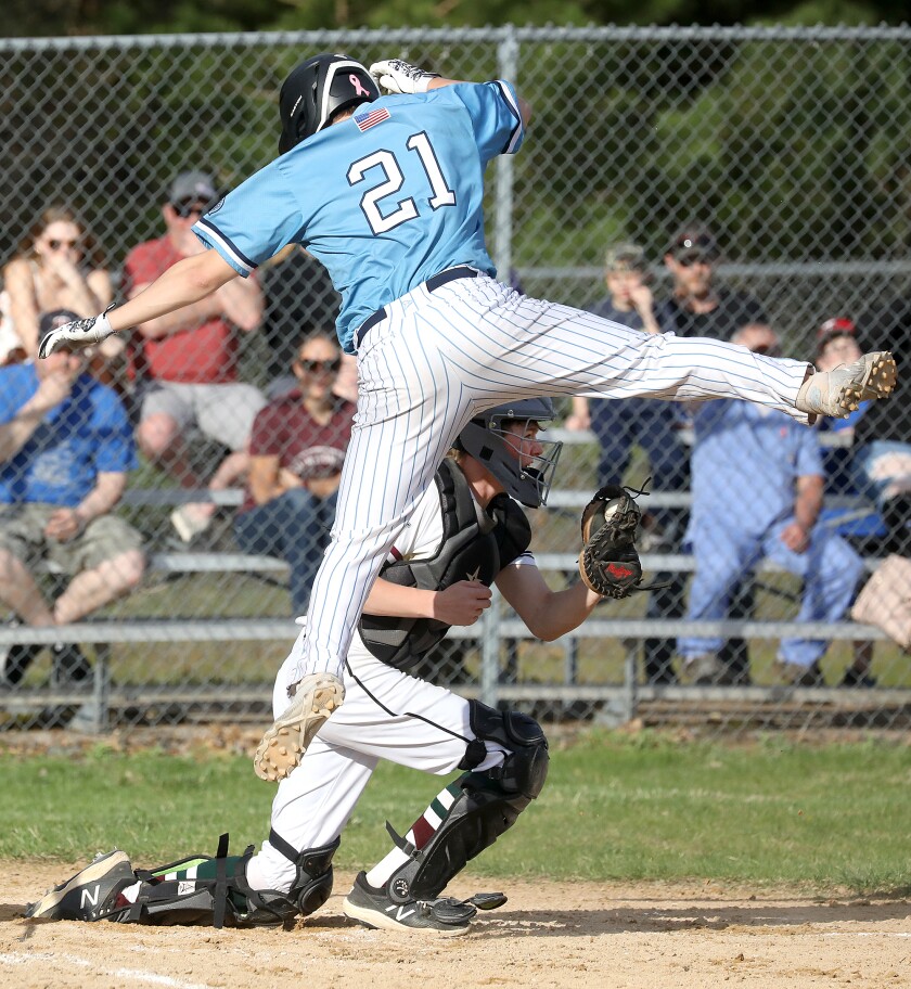 Superior’s Robert Olson (21) gets tagged out by Northwood/Solon Springs catcher Jared Schultz (2)