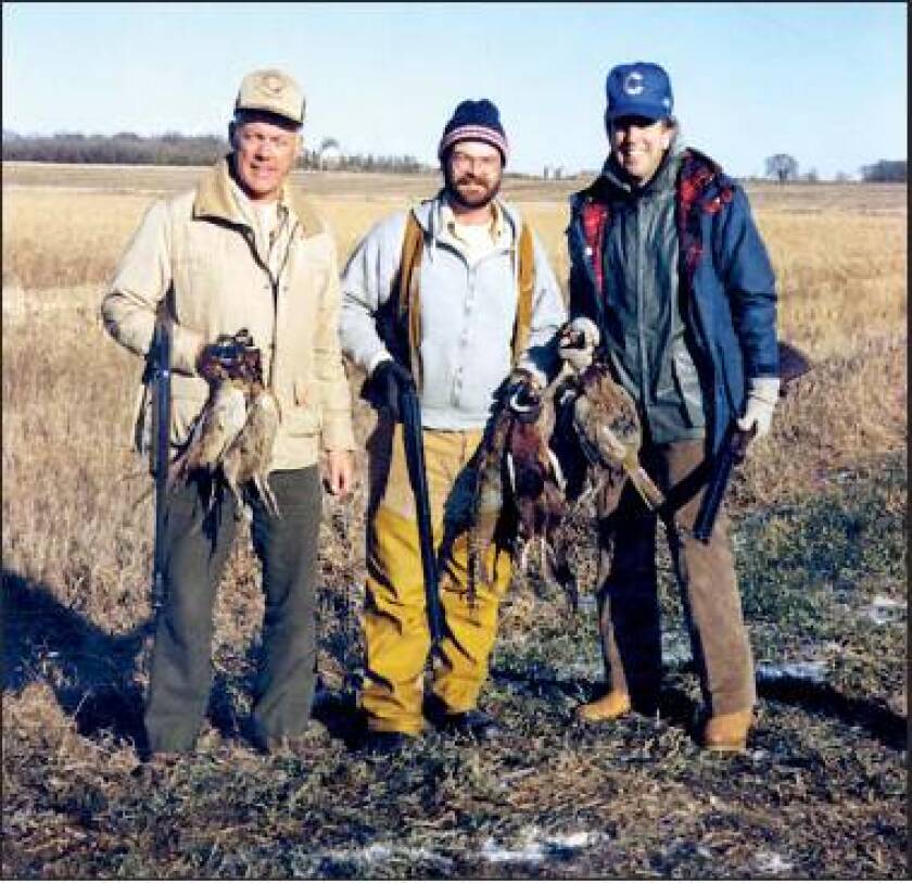 The Kandiyohi County Pheasants Forever chapter was the first in outstate Minnesota. Doug Lovander, one of its founders, center, is shown with former Vikings coach Bud Grant and announcer Brent Musburger on a hunt.