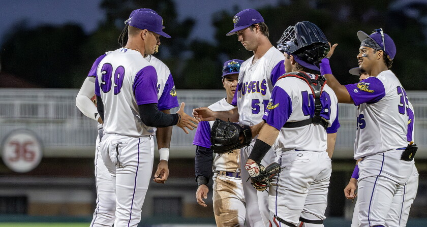 Fort Myers manager Jordan Smith, 39, gets the ball from pitcher Eric Hammond, middle, during a mound visit in a game against Tampa on May 5, 2026 at Hammond Stadium in Fort Myers, Florida.